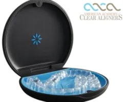 Clear dental aligners inside a black case with blue interior from Sun Park Dental.