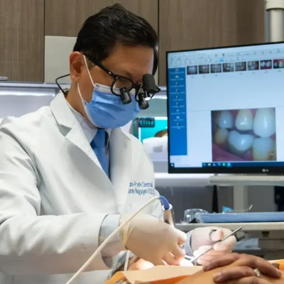 Dr. Minh performing dental implant procedure at Sun Park Dental in Rocklin CA